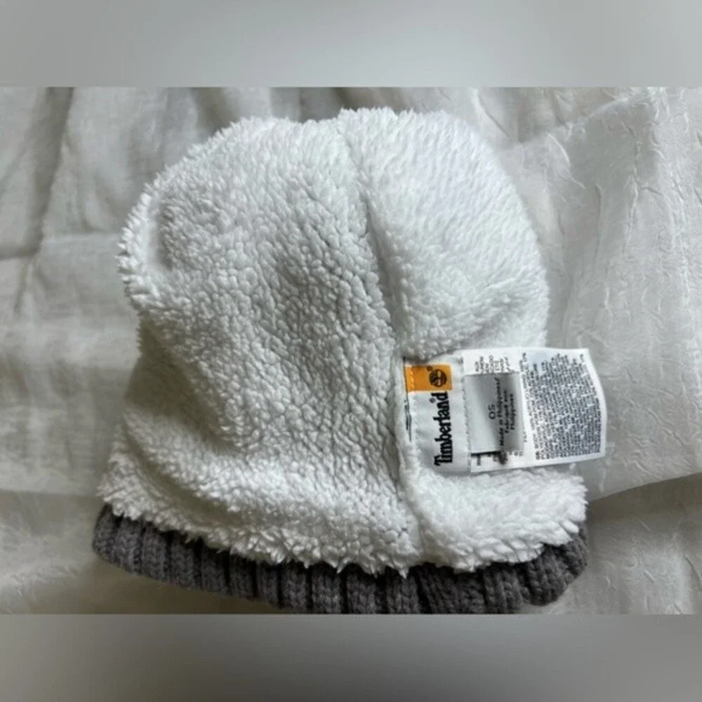 Timberland Women`s Cable Knit Cuff Pom Beanie  Fleece lined Color Gray